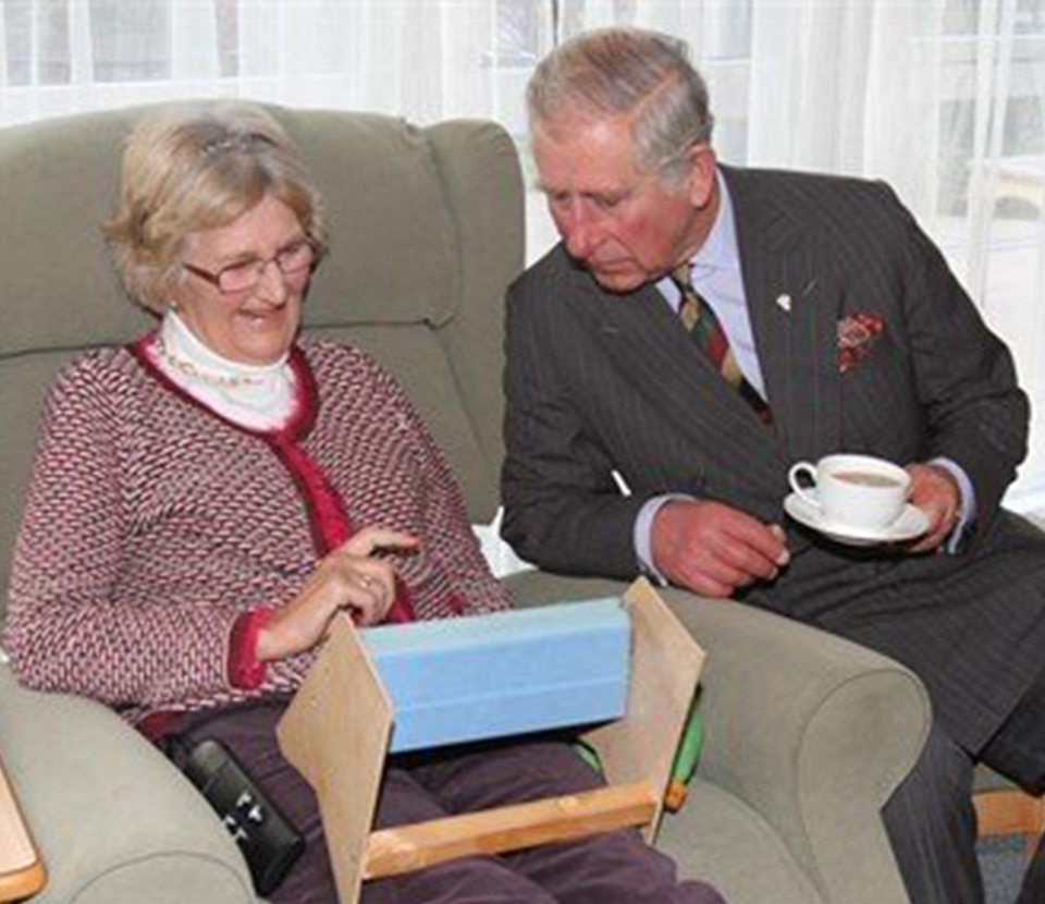 Prince Charles seated visiting Longfield